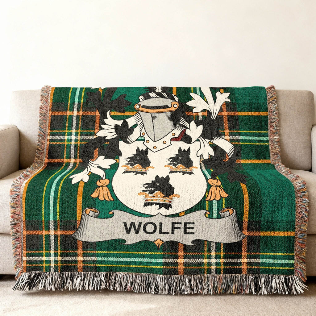 WOLFE family crest on green plaid woven throw blanket.