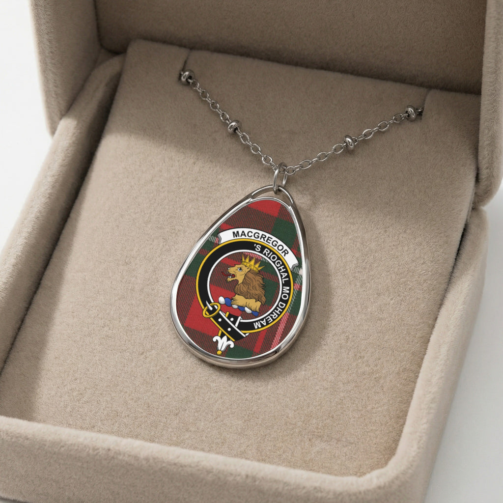 Macgregor clan pendant necklace with lion crest and tartan background in a jewelry box.