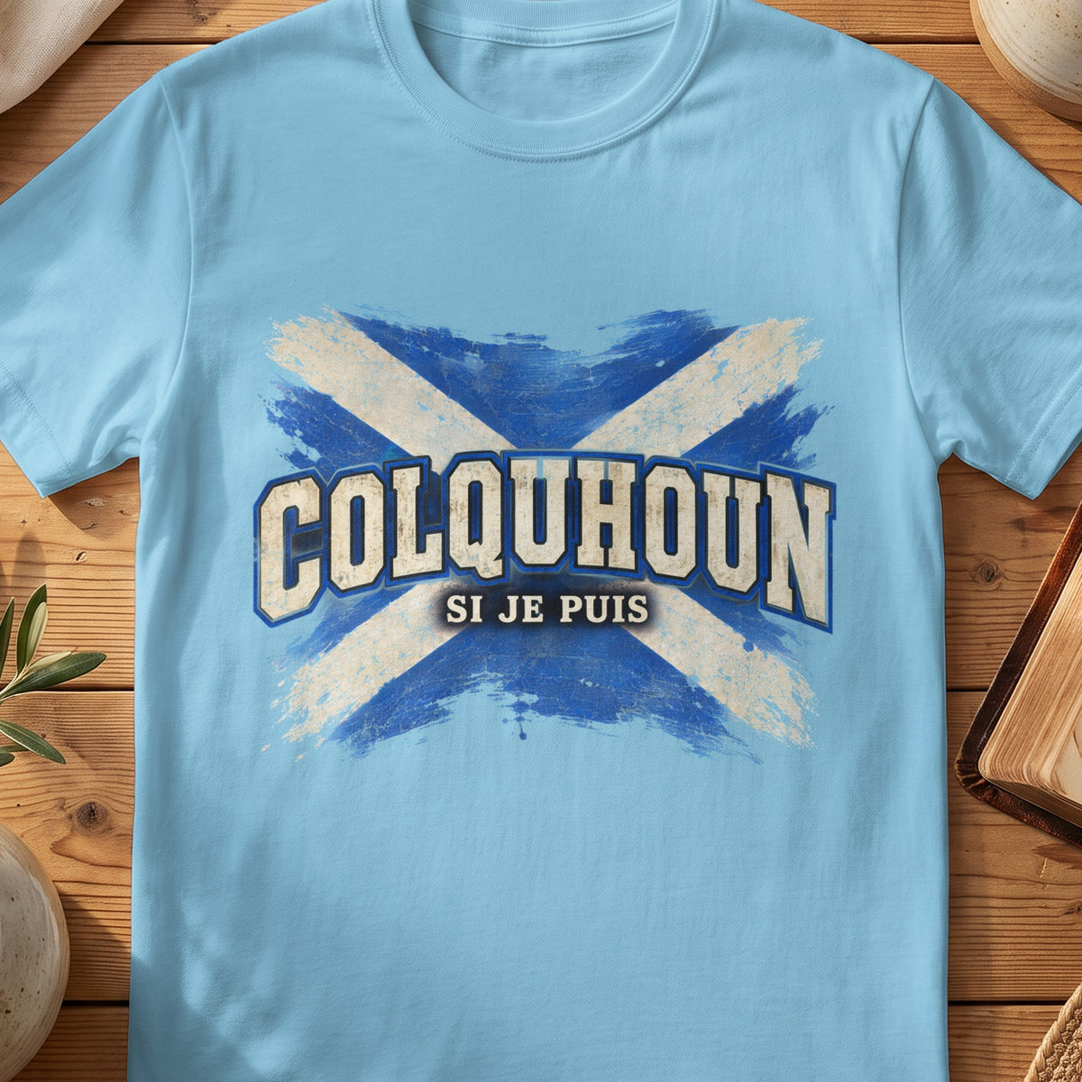 Colquhoun Scottish Saltire T-shirt in Sky, with distressed blue and cream flag and “Si Je Puis” lettering.