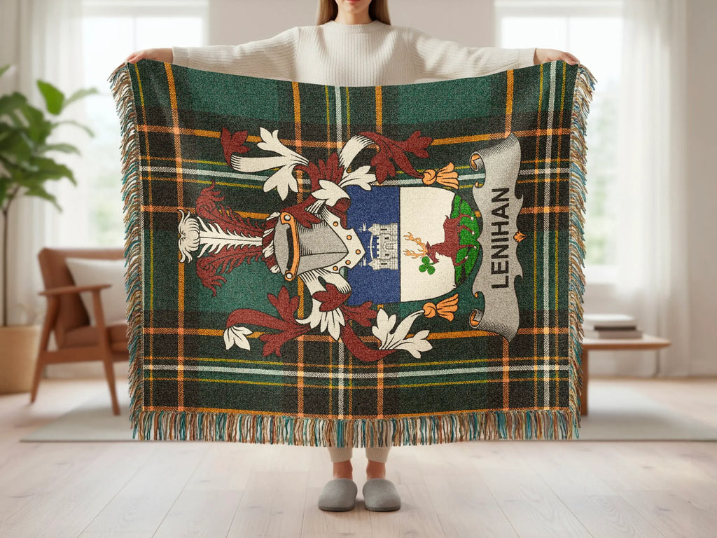 Tartan blanket with crest and "LENIHAN" text held by a person.