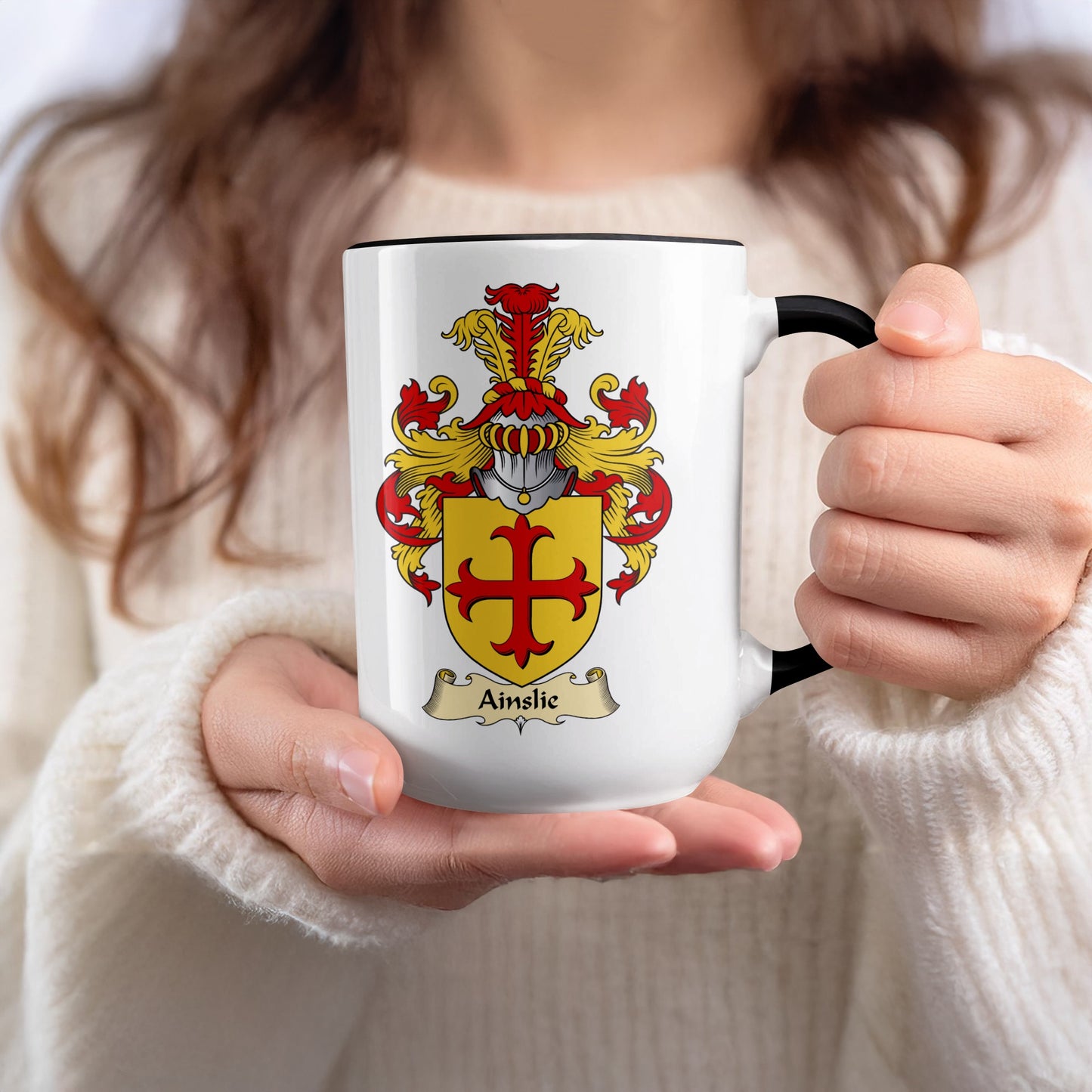 Mug featuring the Ainslie coat of arms with a yellow shield and red cross.