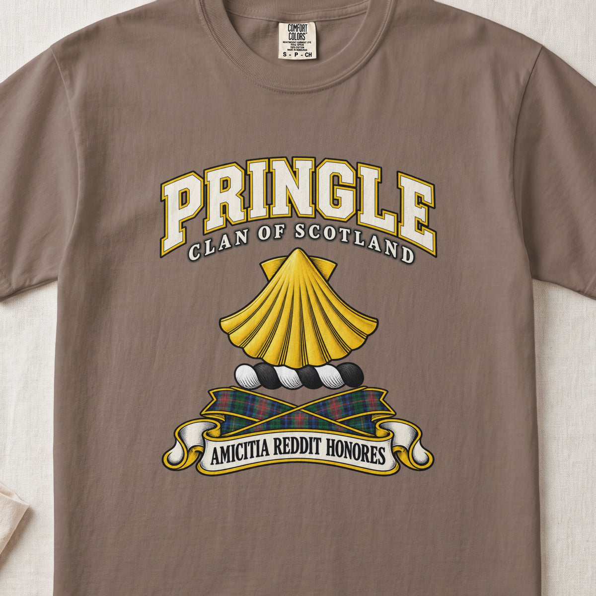 Pringle Scottish clan T-shirt in Espresso, front view with a golden scallop shell and motto design.