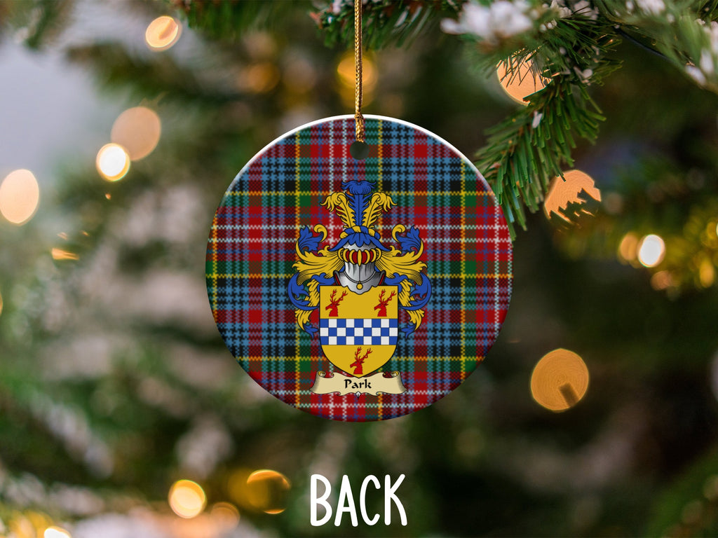 Park ceramic ornament detail showing a double-sided family shield on a Caledonia tartan background