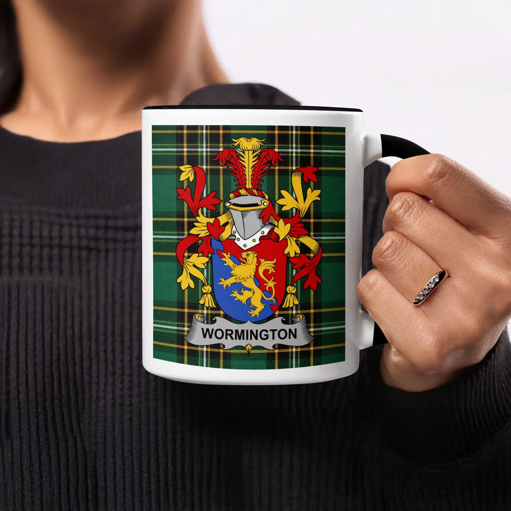 Black mug featuring the Wormington family crest on a green tartan background.