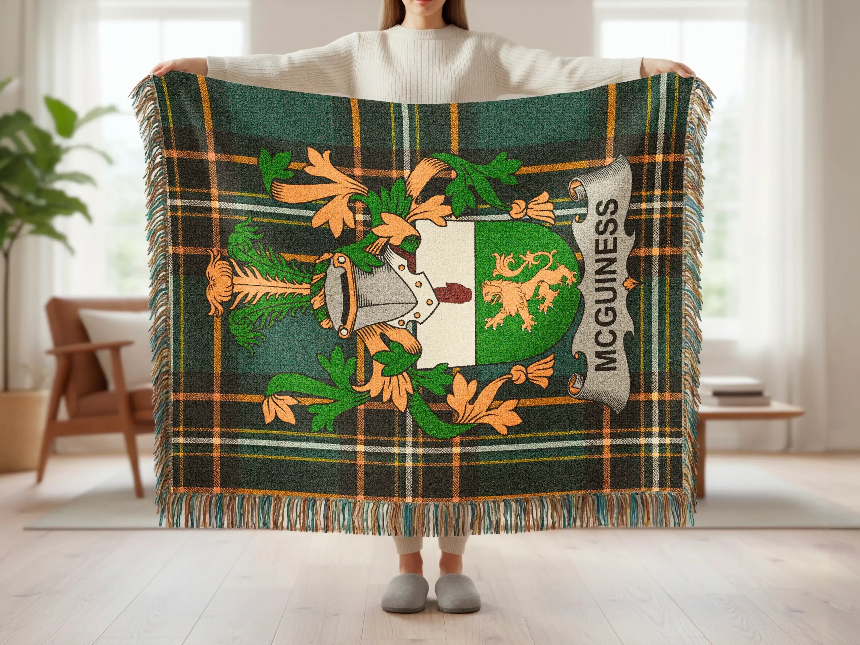 Green and orange tartan blanket with a central coat of arms, "MCGUINNESS" text.