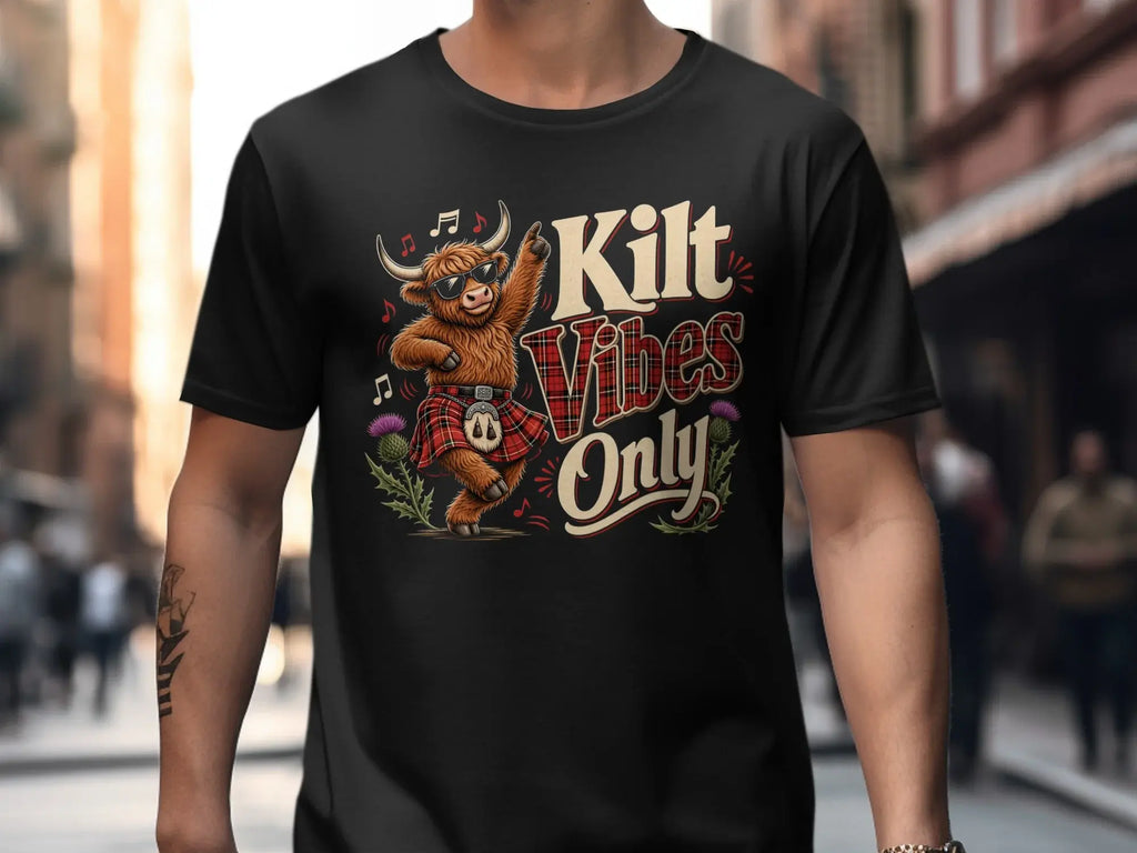 Black t-shirt with graphic of a highland cow dancing in a kilt, "Kilt Vibes Only".