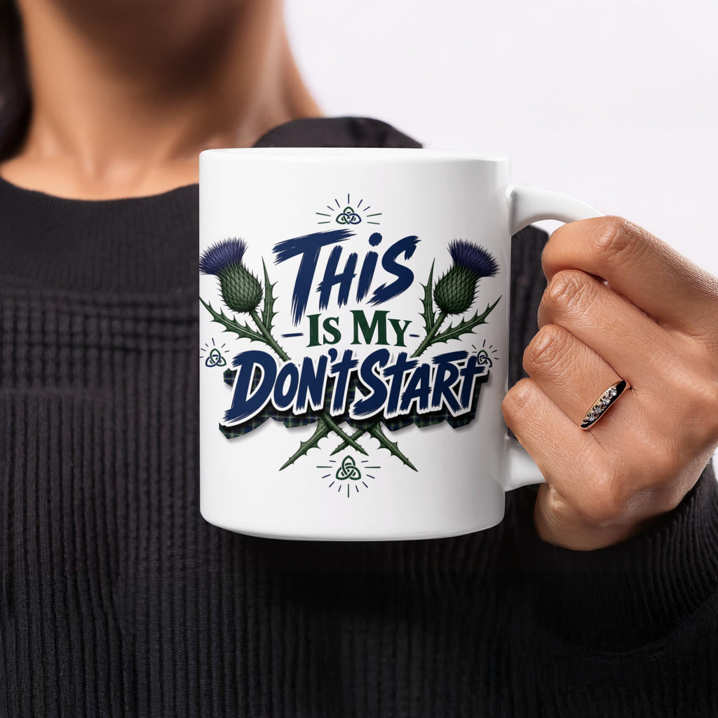 White mug with "This Is My Don't Start" text and thistle designs.