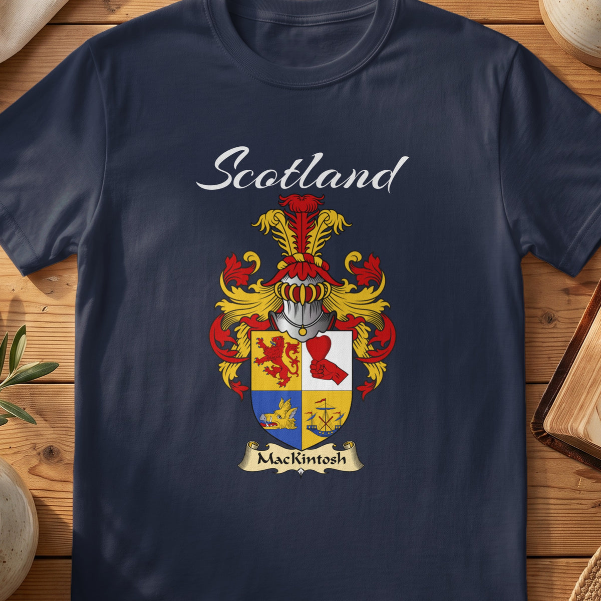 Navy MacKintosh family shield T-shirt featuring a quartered red, gold and blue shield