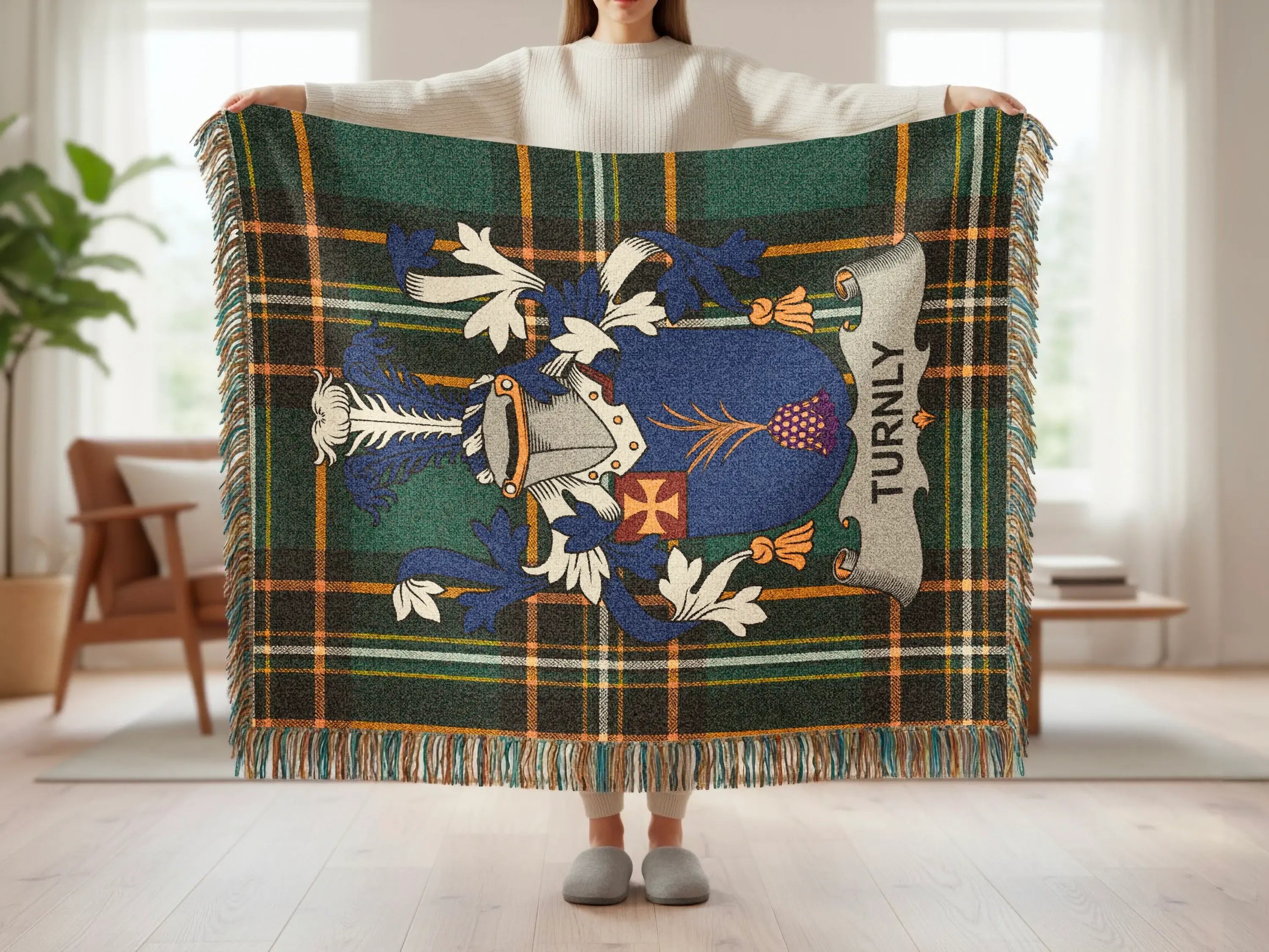 Tartan blanket with a blue and white coat of arms and "TURNLY" text.