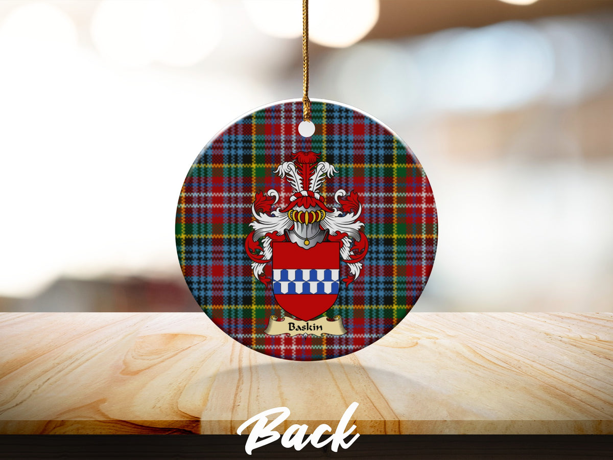 Round Baskin Scottish clan ornament with family crest on a Caledonia tartan background