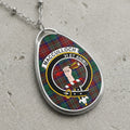 MacCulloch clan crest necklace with tartan background and Latin motto.