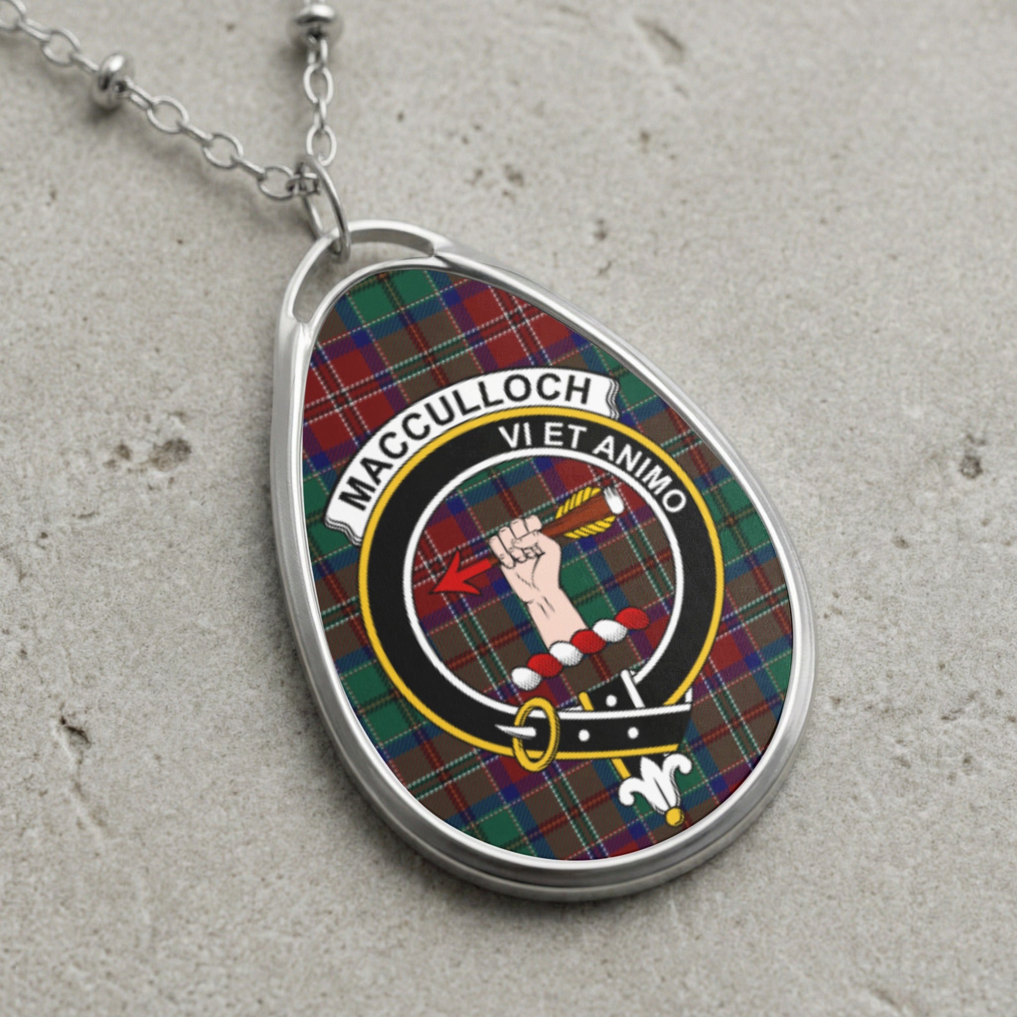 MacCulloch clan crest necklace with tartan background and Latin motto.