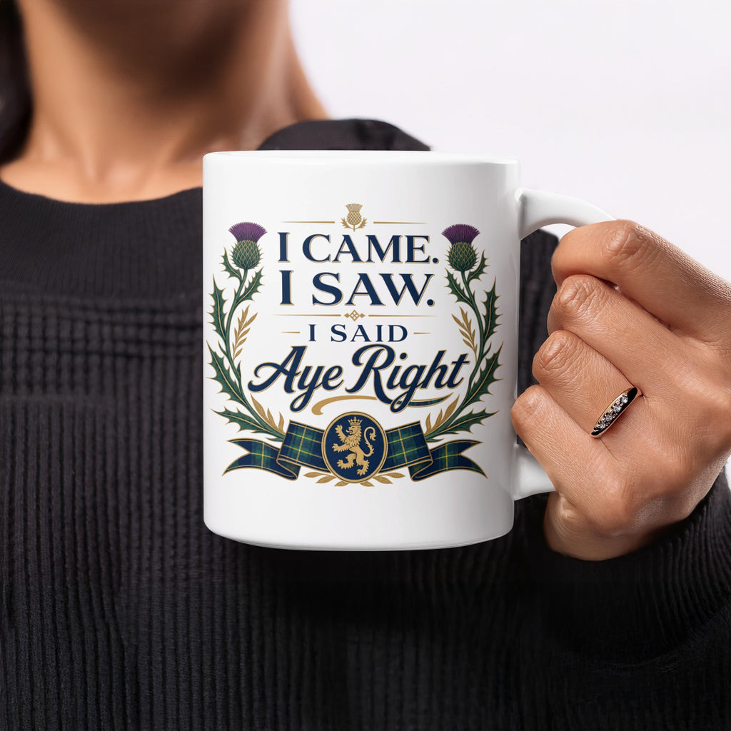 White mug with "I Came, I Saw, I Said Aye Right" and Scottish thistle design.