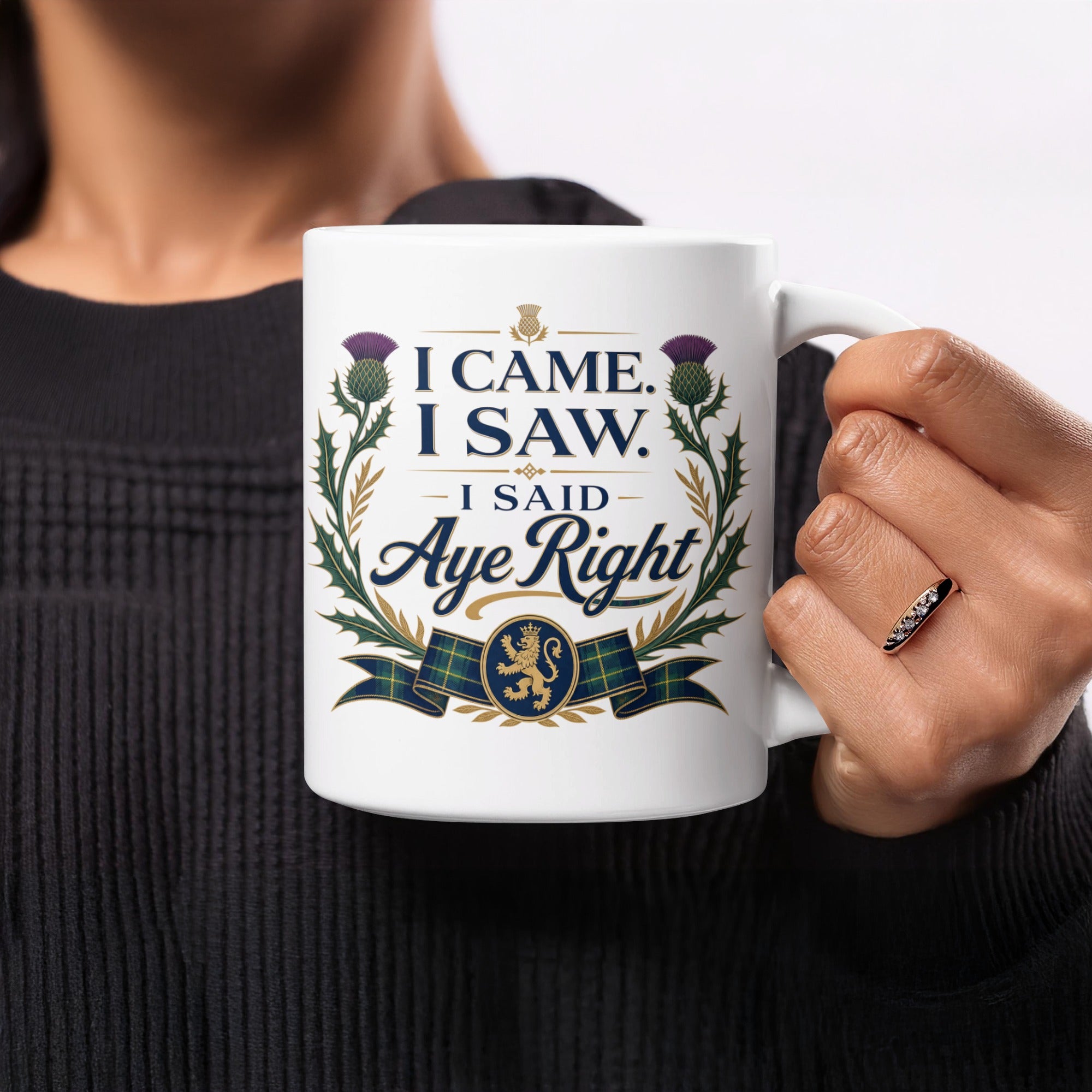 White mug with "I Came, I Saw, I Said Aye Right" and Scottish thistle design.