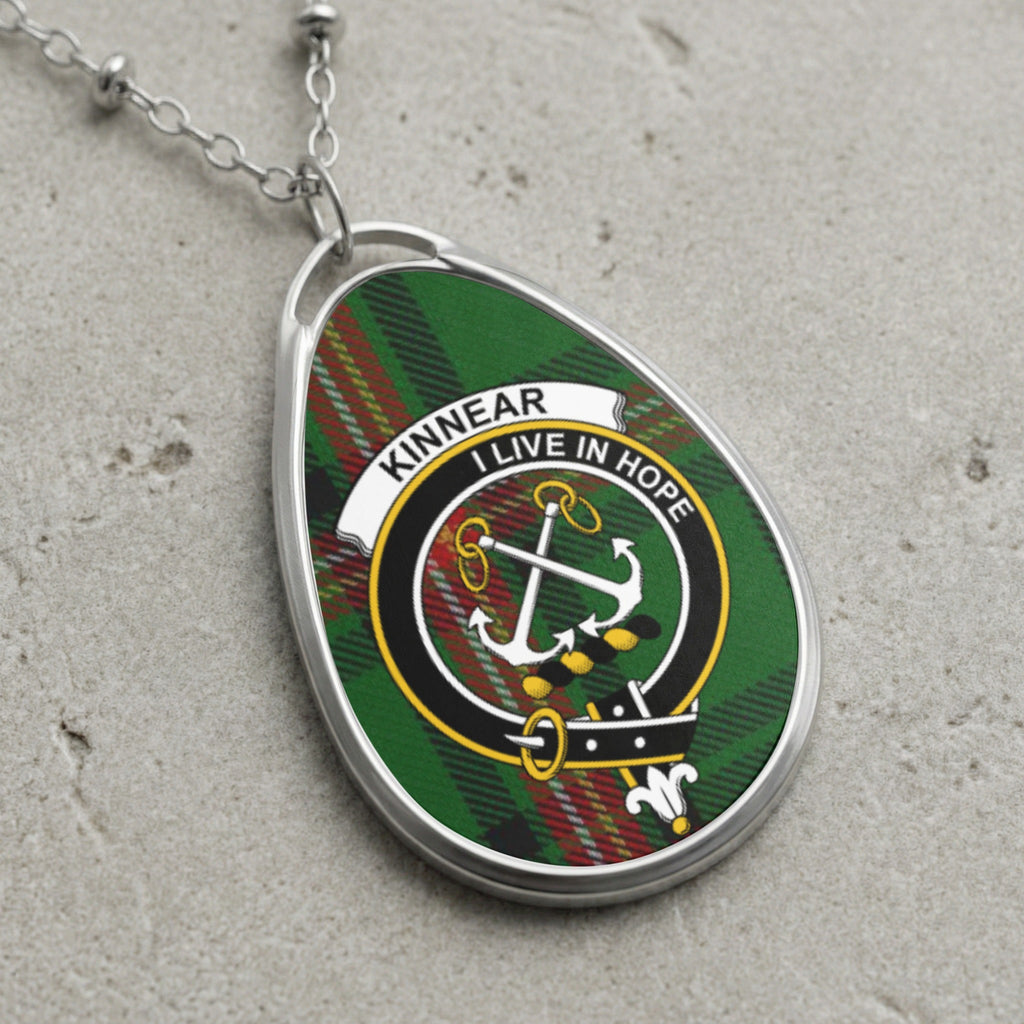 Kinnear clan Scottish tartan necklace with clan crest on tartan background