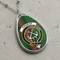 Kinnear clan Scottish tartan necklace with clan crest on tartan background