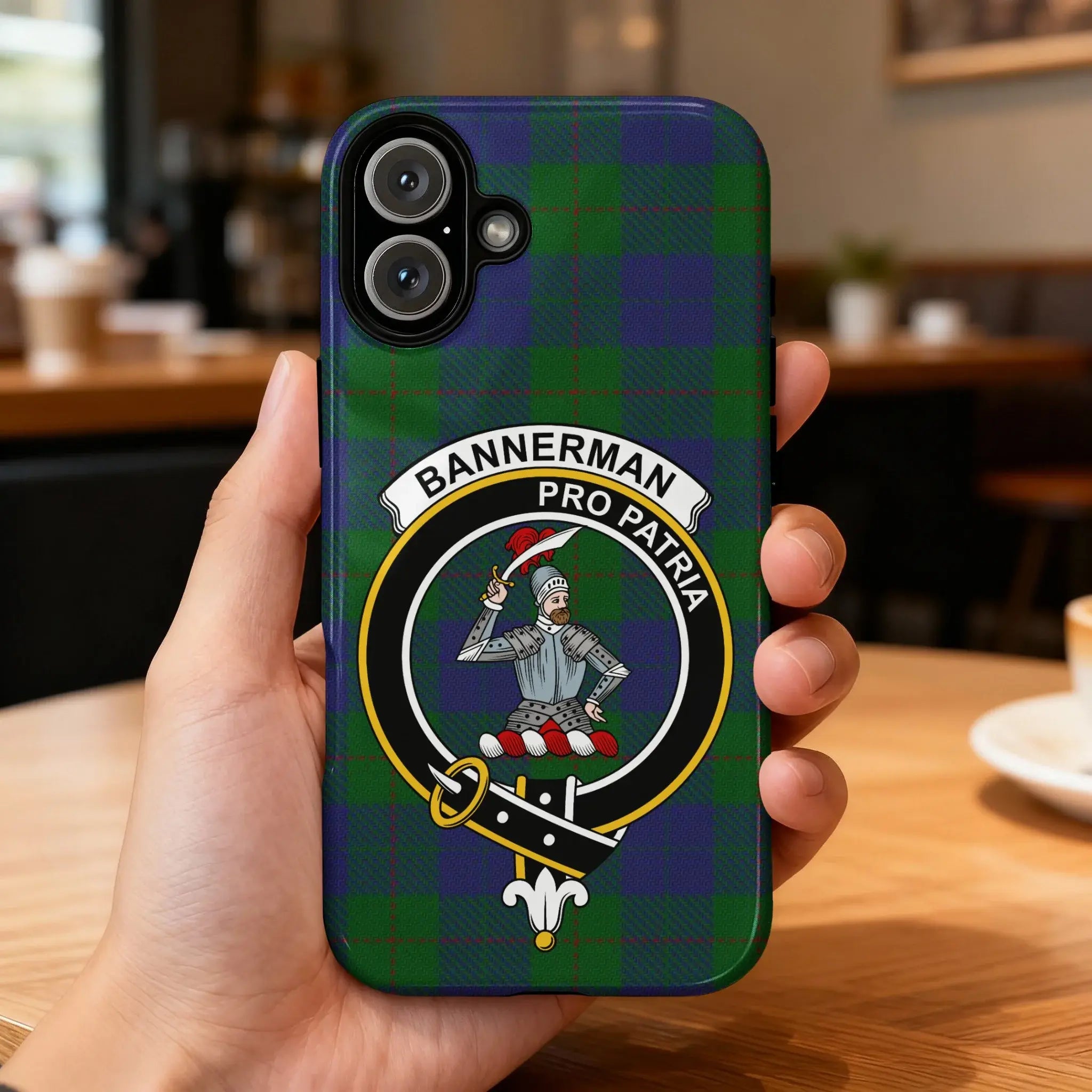 Clan Bannerman pro patria Scottish tartan phone case — glossy edge-to-edge crest print, iPhone shown