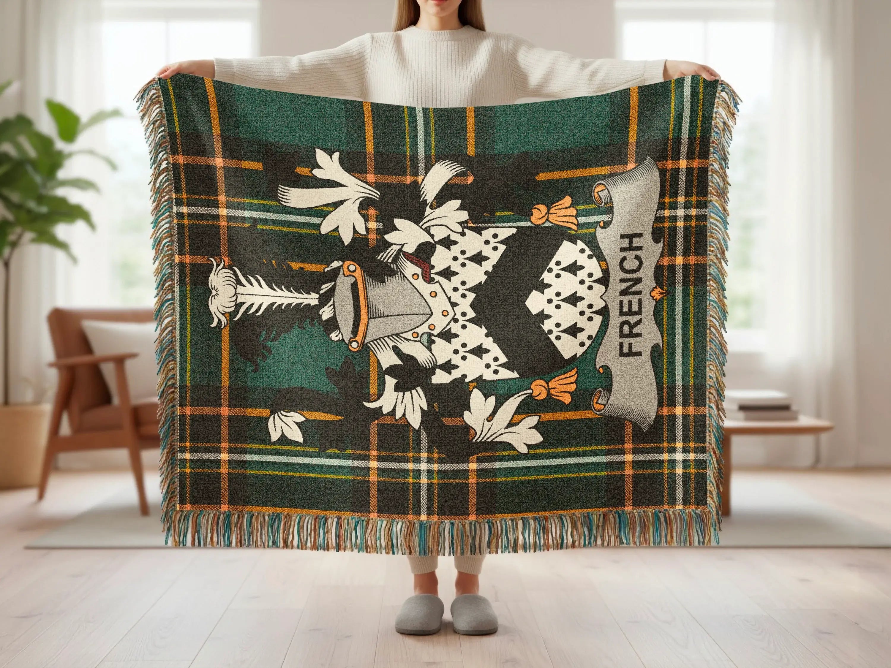 Tartan blanket with French coat of arms and fringe.