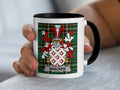 White mug with black rim featuring a red and white coat of arms and the text "BRACKEN".