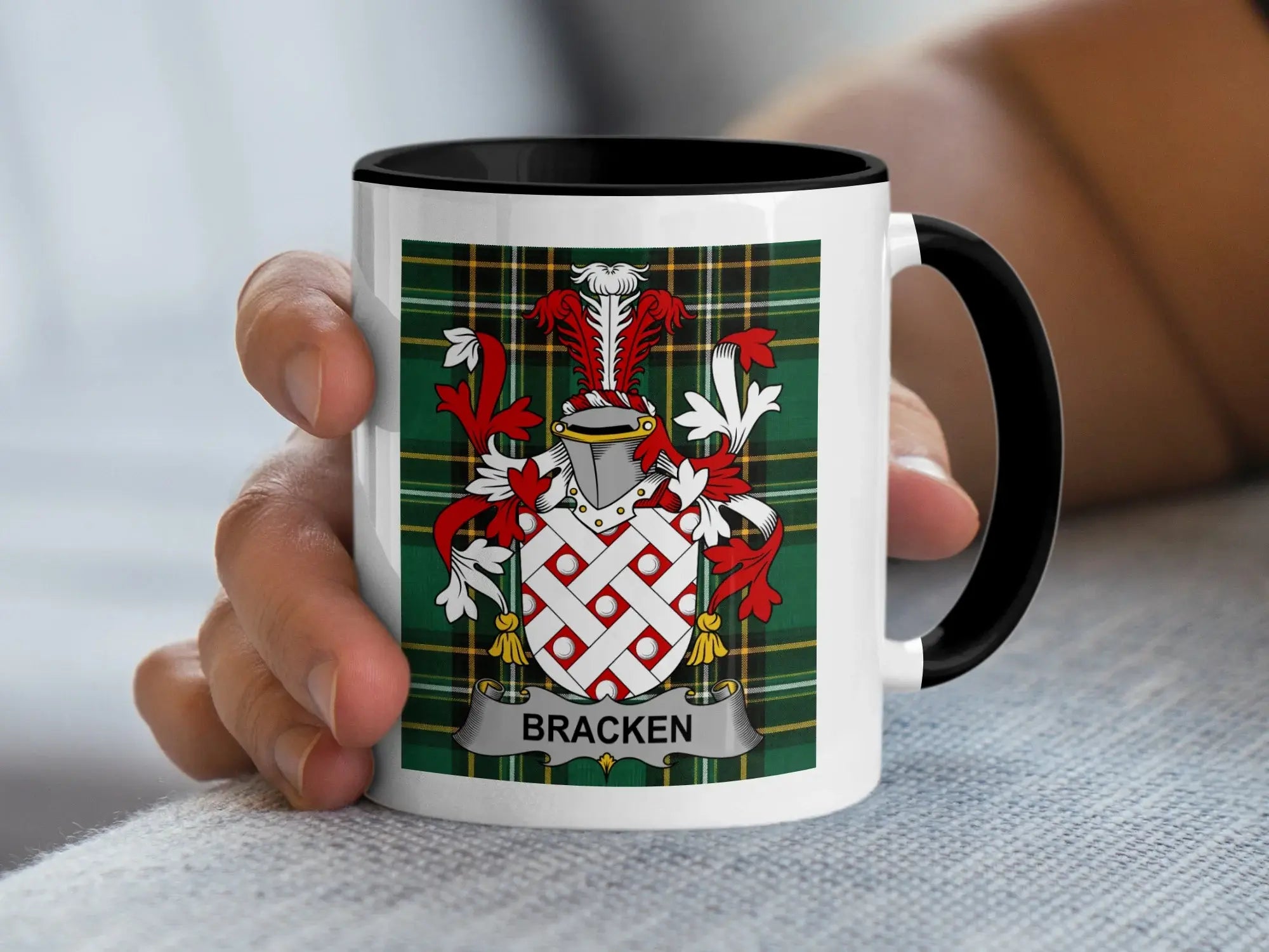 White mug with black rim featuring a red and white coat of arms and the text "BRACKEN".