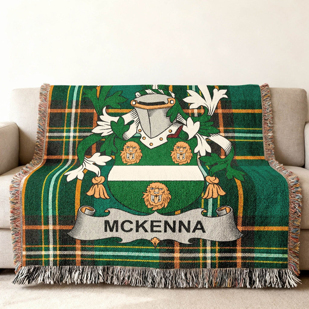 Green tartan throw blanket with McKenna family crest.