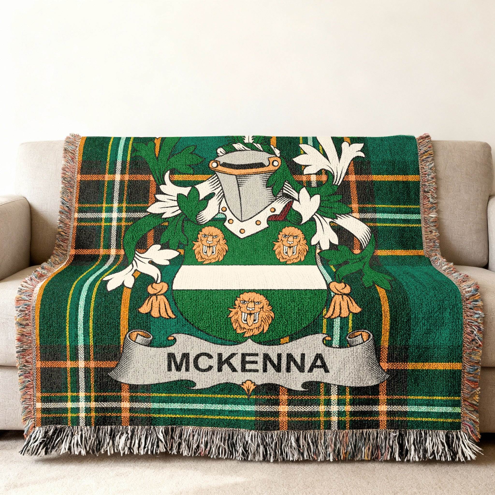 Green tartan throw blanket with McKenna family crest.