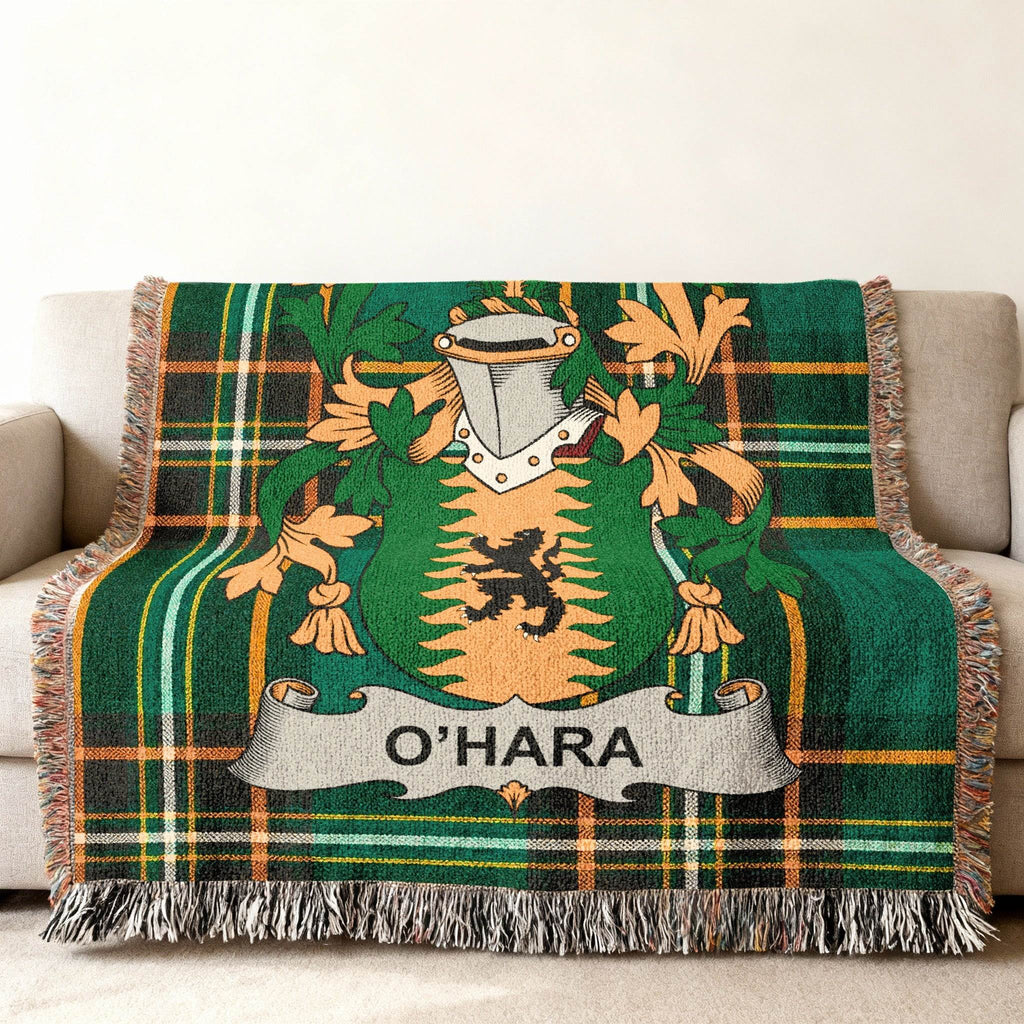 O'Hara family crest on a green plaid woven throw blanket with fringe.