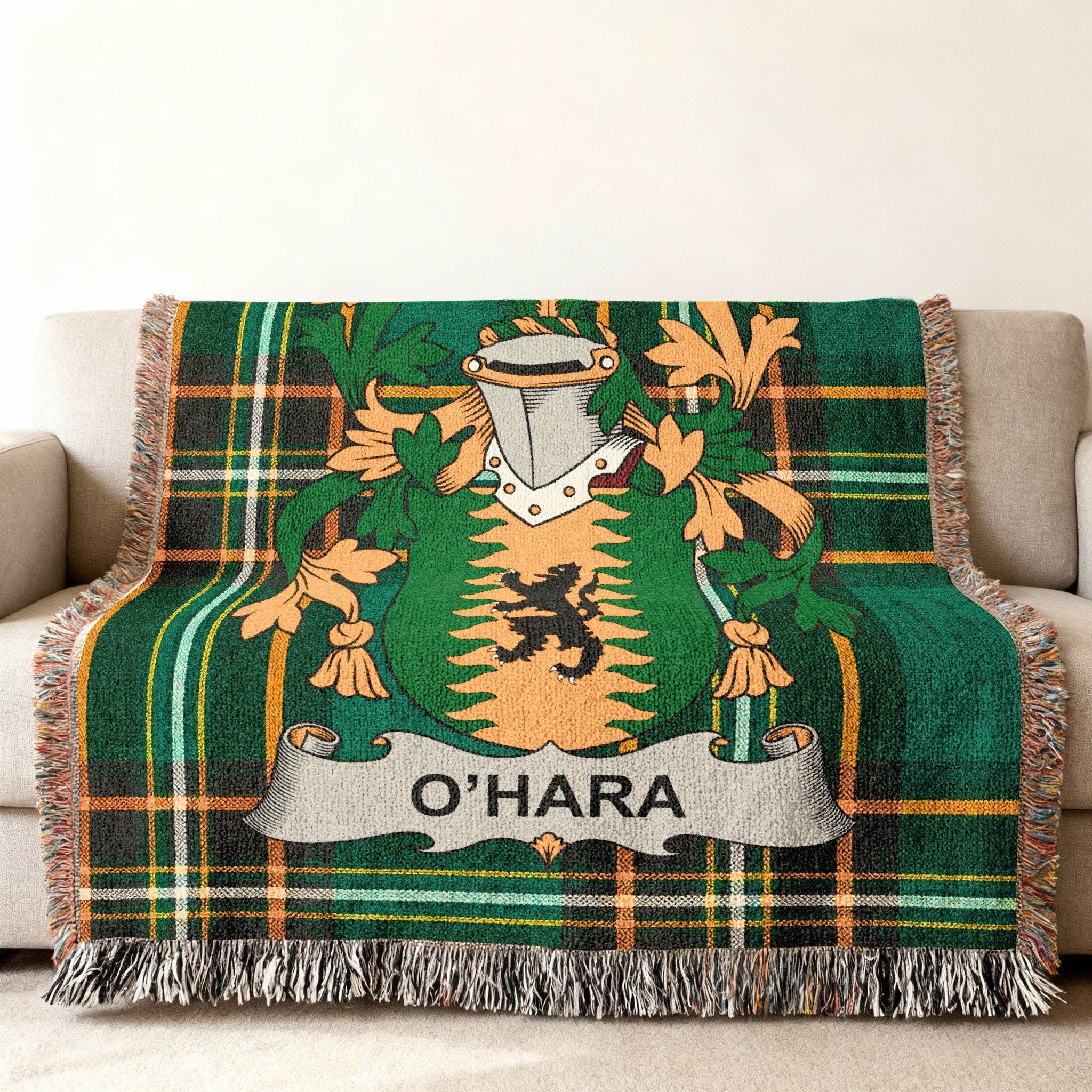 O'Hara family crest on a green plaid woven throw blanket with fringe.