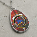Bruce clan Scottish tartan necklace with clan crest and Fuimus motto on tartan background