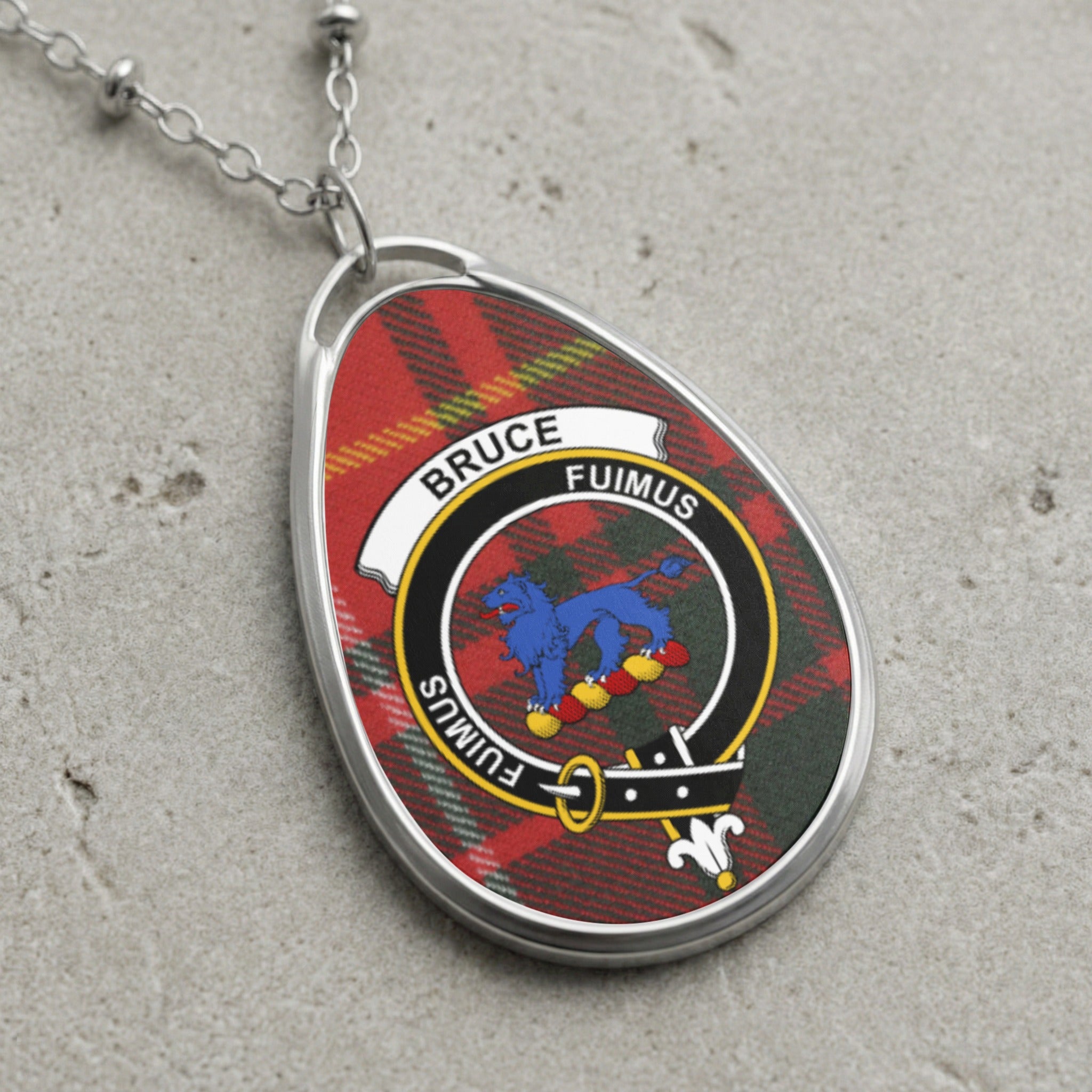 Bruce clan Scottish tartan necklace with clan crest and Fuimus motto on tartan background