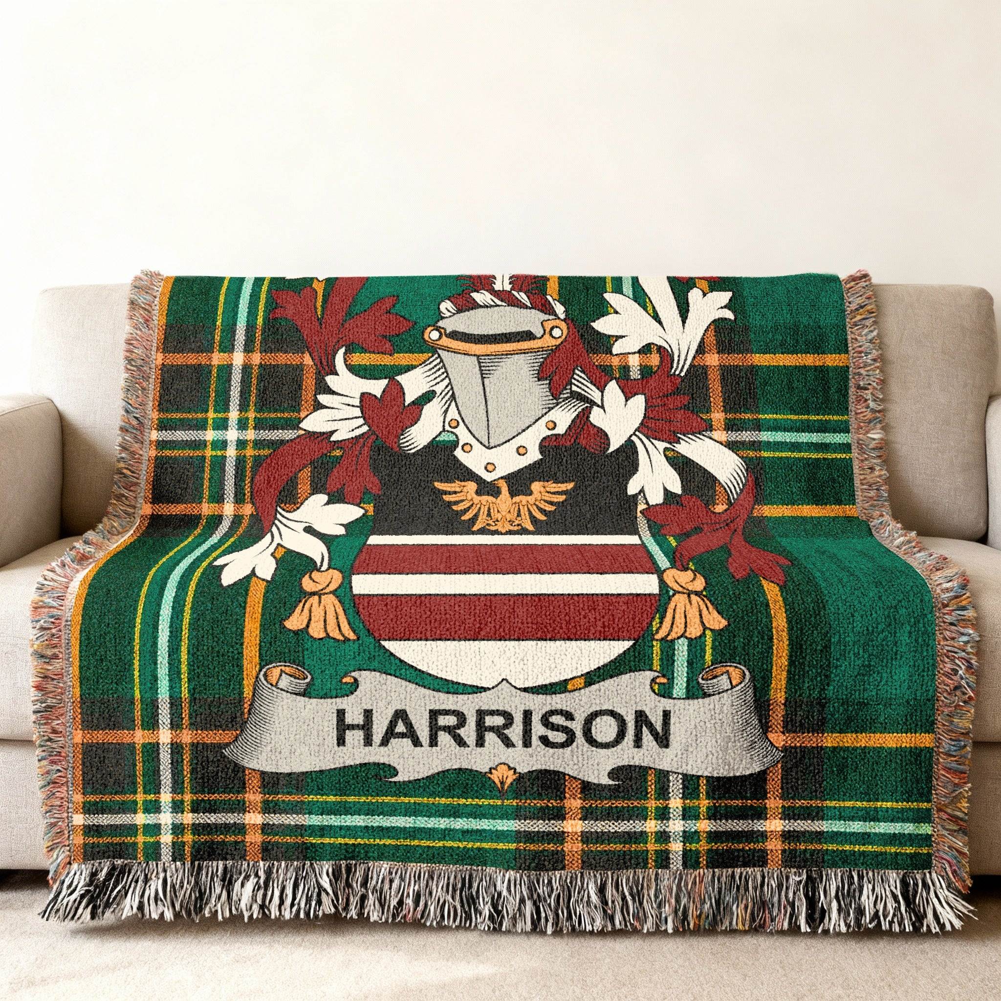 Woven throw blanket with Harrison family crest and tartan plaid pattern.
