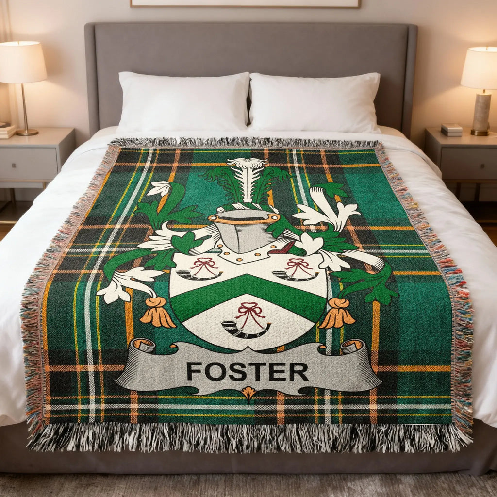 Foster family crest on a green tartan plaid blanket.