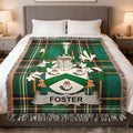 Foster family crest on a green tartan plaid blanket.