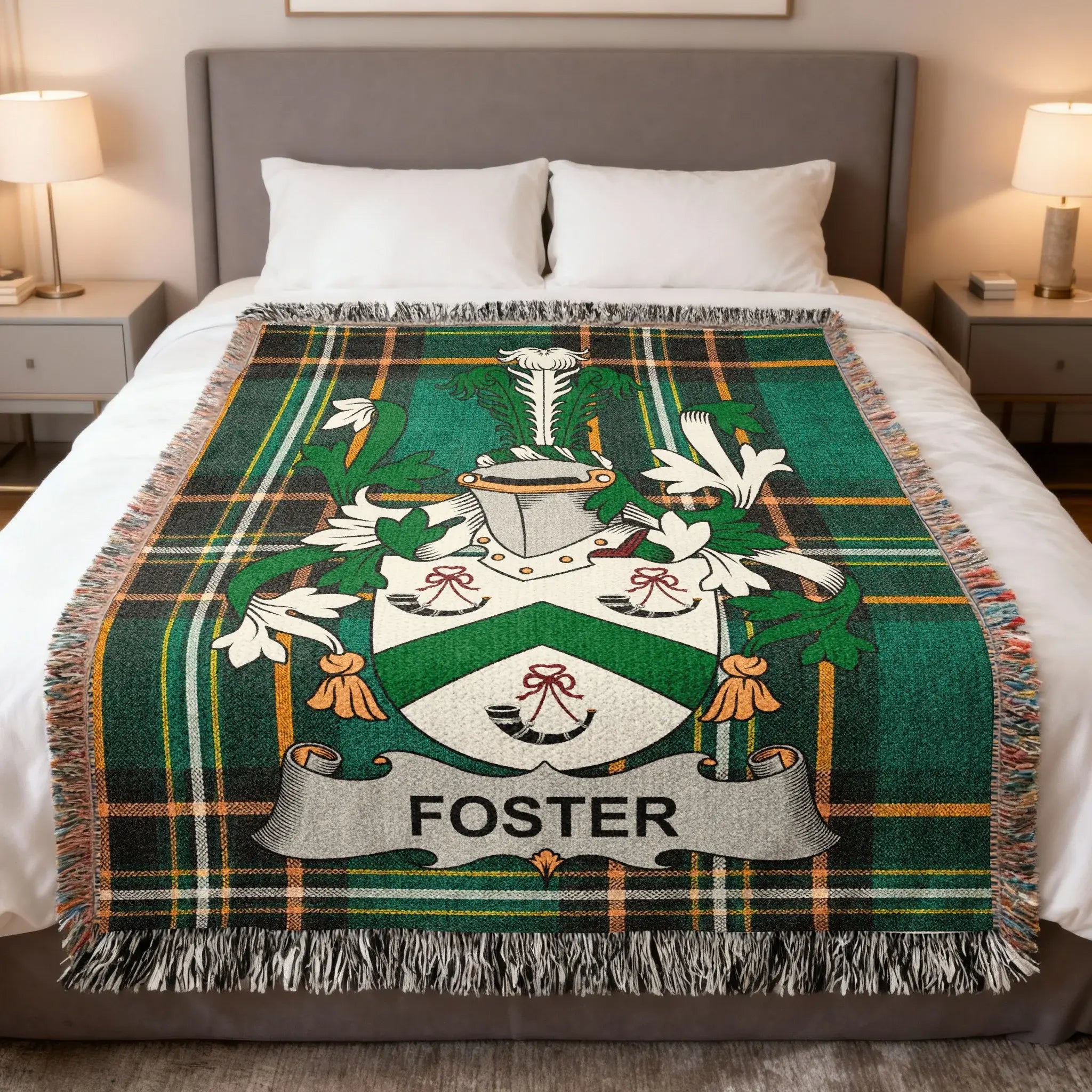 Foster family crest on a green tartan plaid blanket.