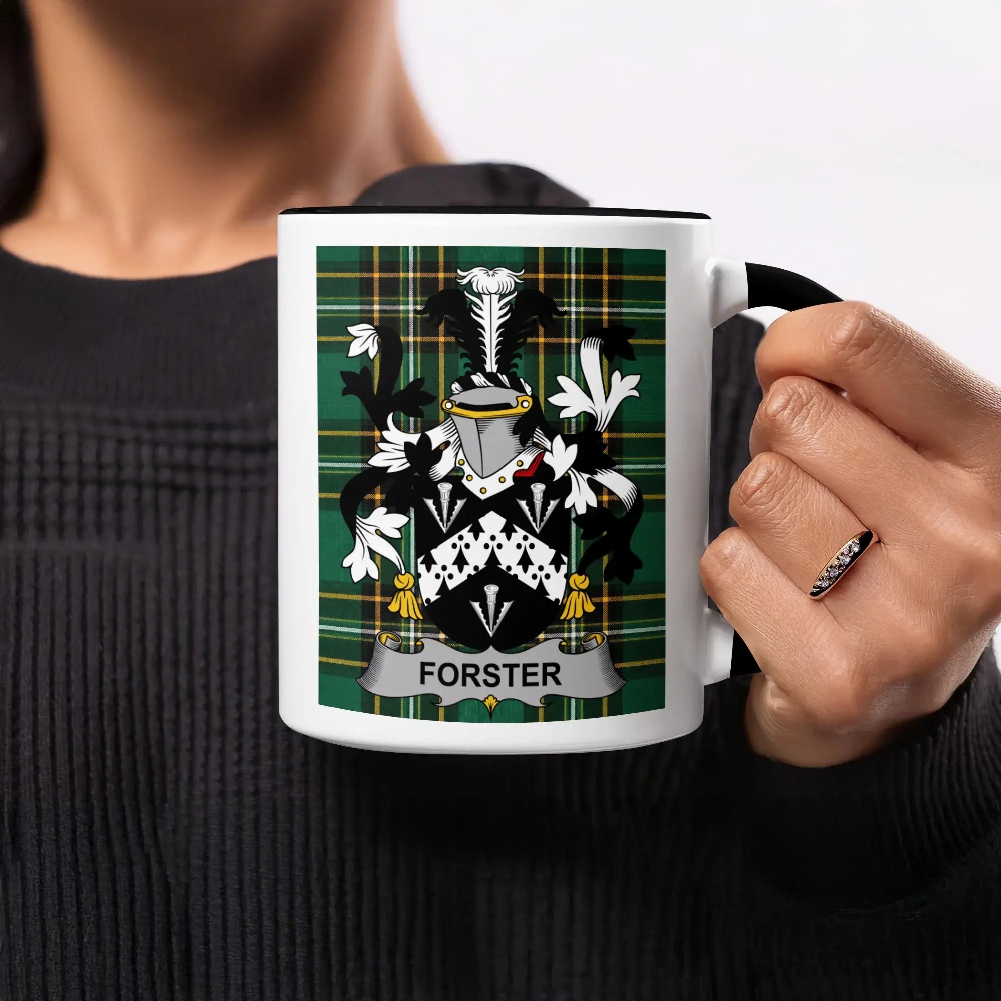 Mug with Forrster family crest on green plaid background.