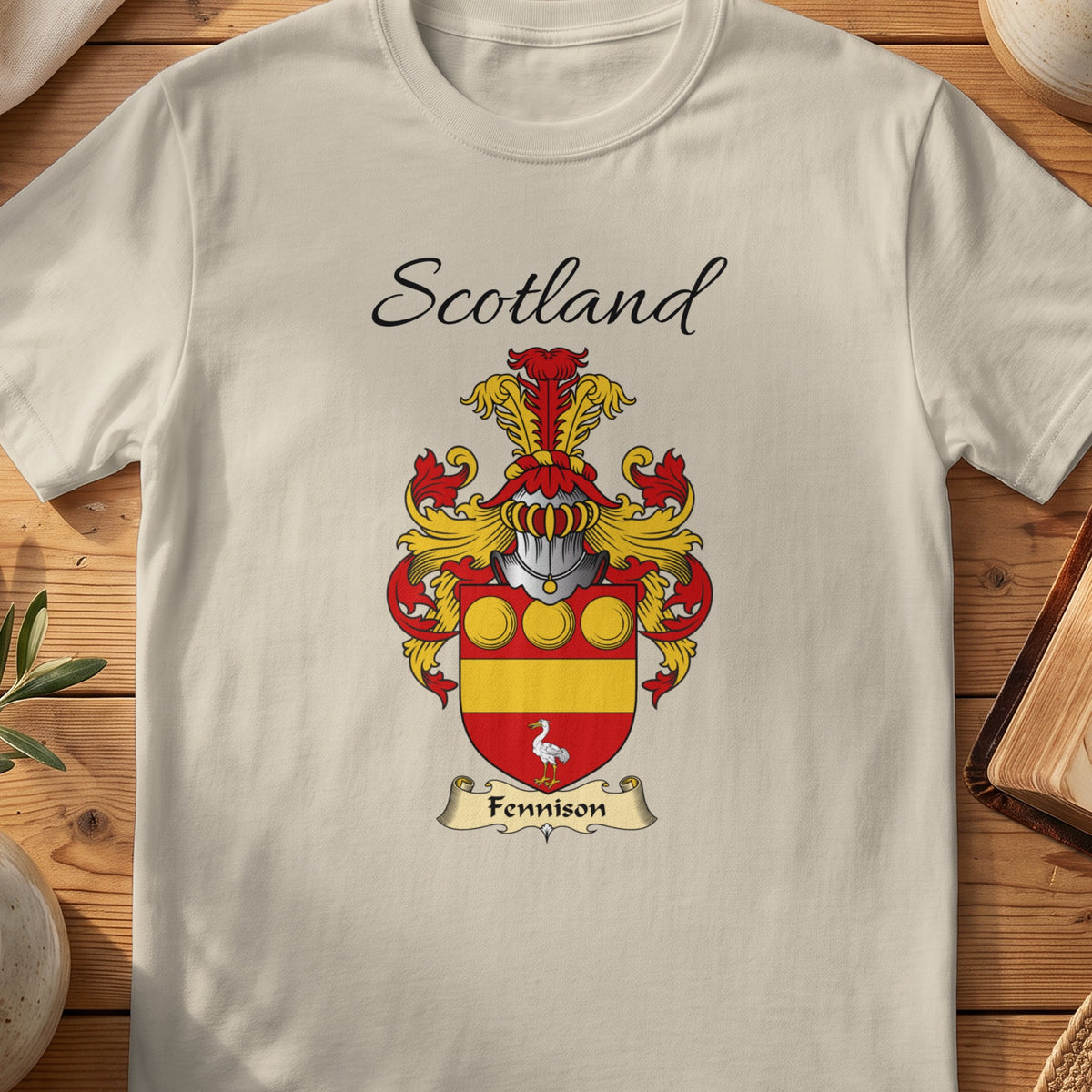 Sand Fennison Scottish family shield T-shirt featuring gold roundels and a gold band on red