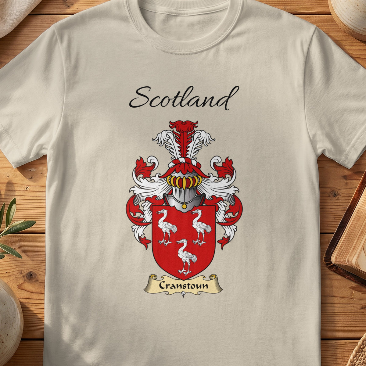 Sand Cranstoun Scottish family shield T-shirt featuring three white long-legged birds on red