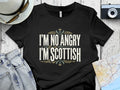 Black t-shirt with "I'M NO ANGRY I'M SCOTTISH" text and thistle graphic.