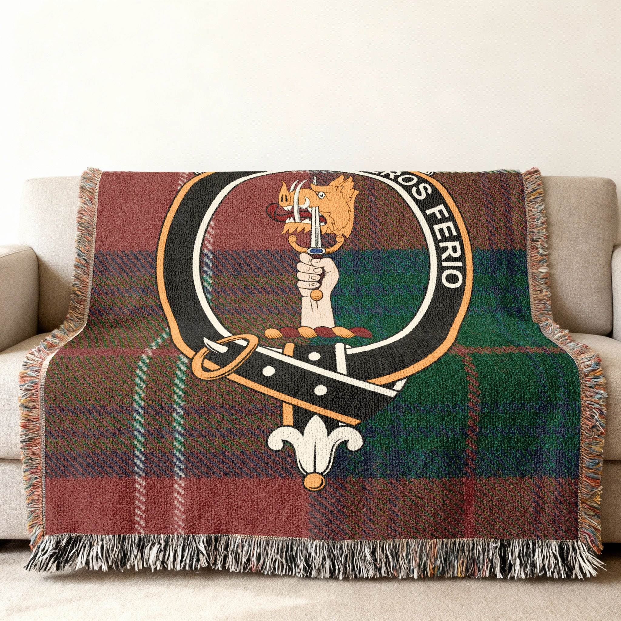 Chisholm clan tartan woven blanket — green-red plaid with Feros Ferio crest, fringe edges