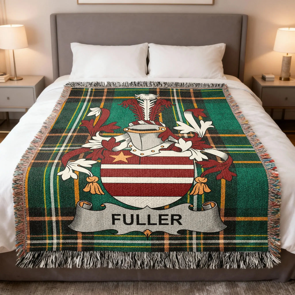 Plaid blanket with Fuller family crest in center, draped on a bed.
