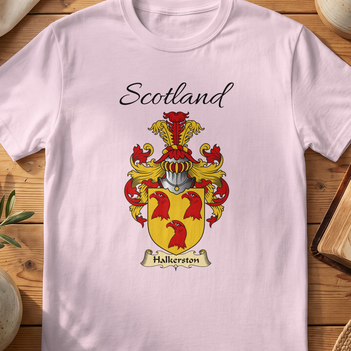 Light Pink Halkerston Scottish family shield T-shirt featuring three red bird heads on gold