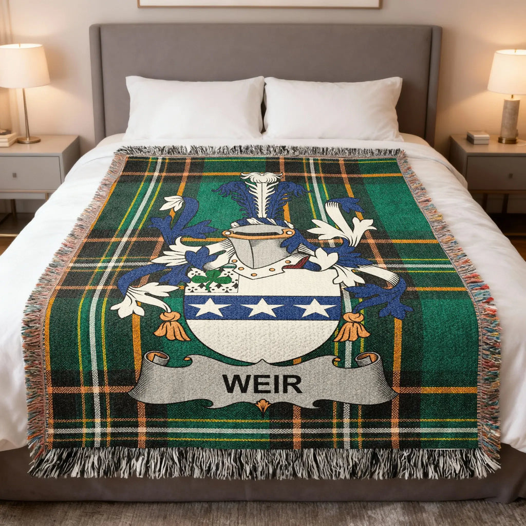 Tartan blanket with the Weir family crest and name in blue, white, and green.