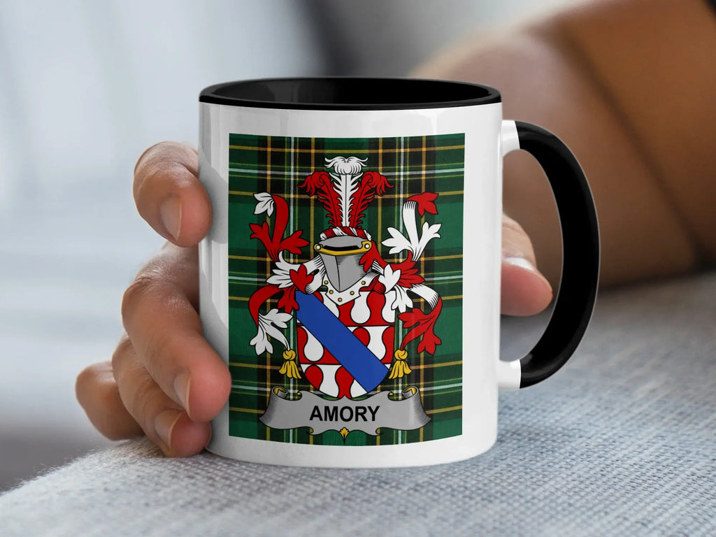 Mug with a coat of arms and the name "AMORY" on a plaid background.