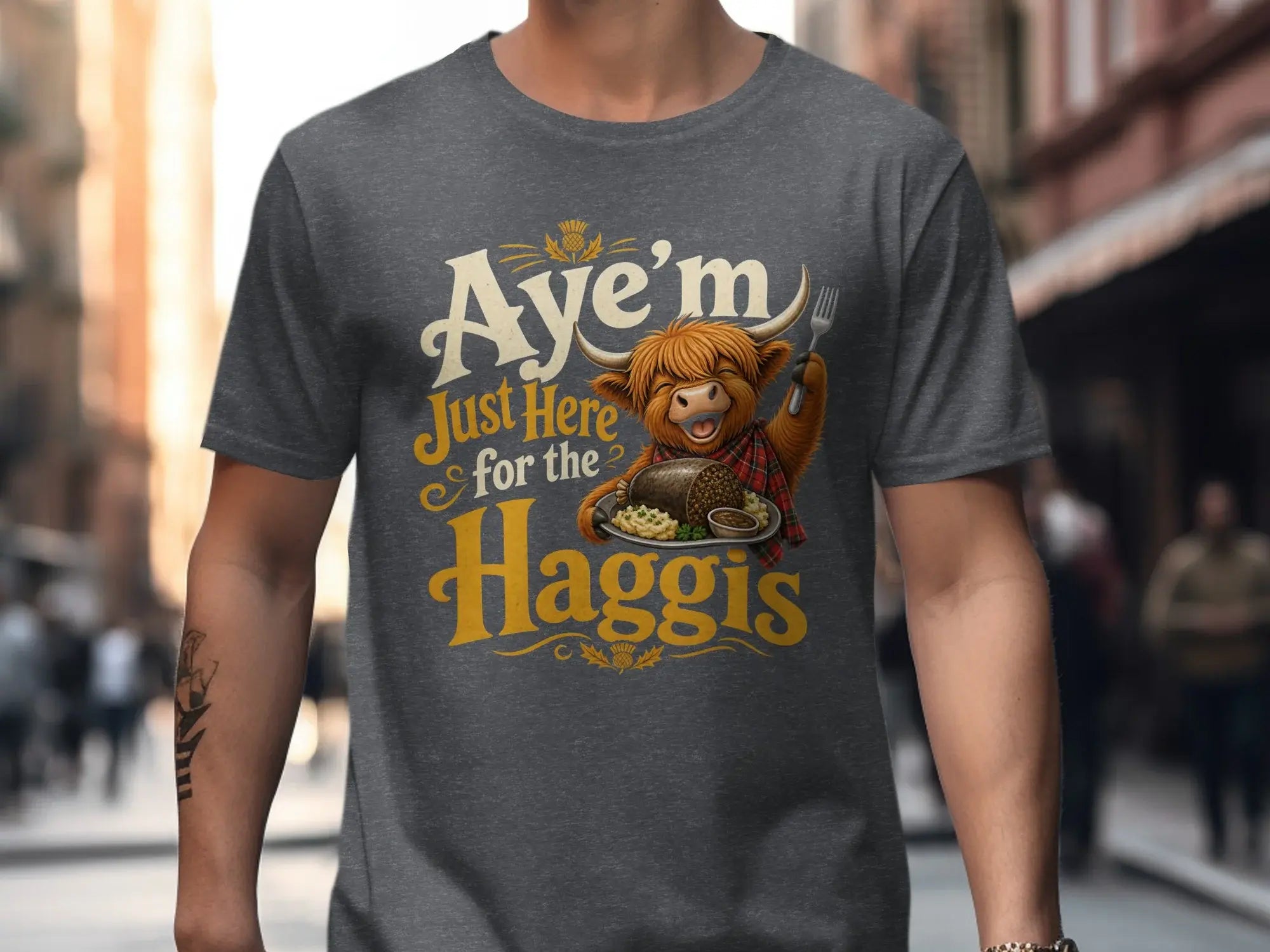 Grey t-shirt with highland cow saying "Aye'm Just Here for the Haggis".