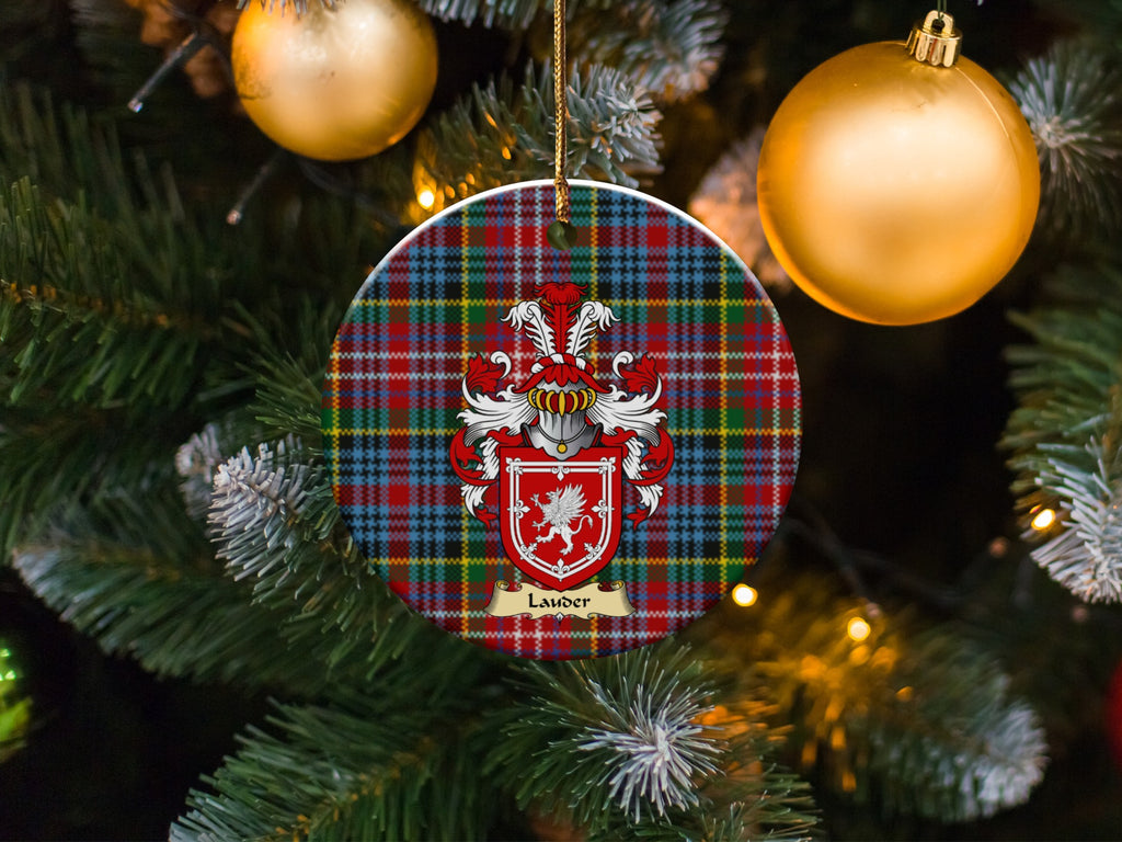 Lauder family emblem ceramic Christmas ornament with Caledonia tartan background in festive holiday décor