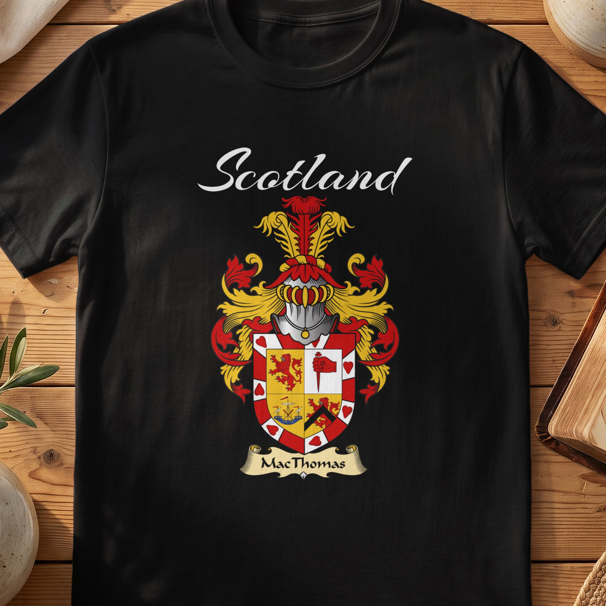 Black MacThomas Scottish T-shirt featuring a quartered red-and-gold shield with a decorative border