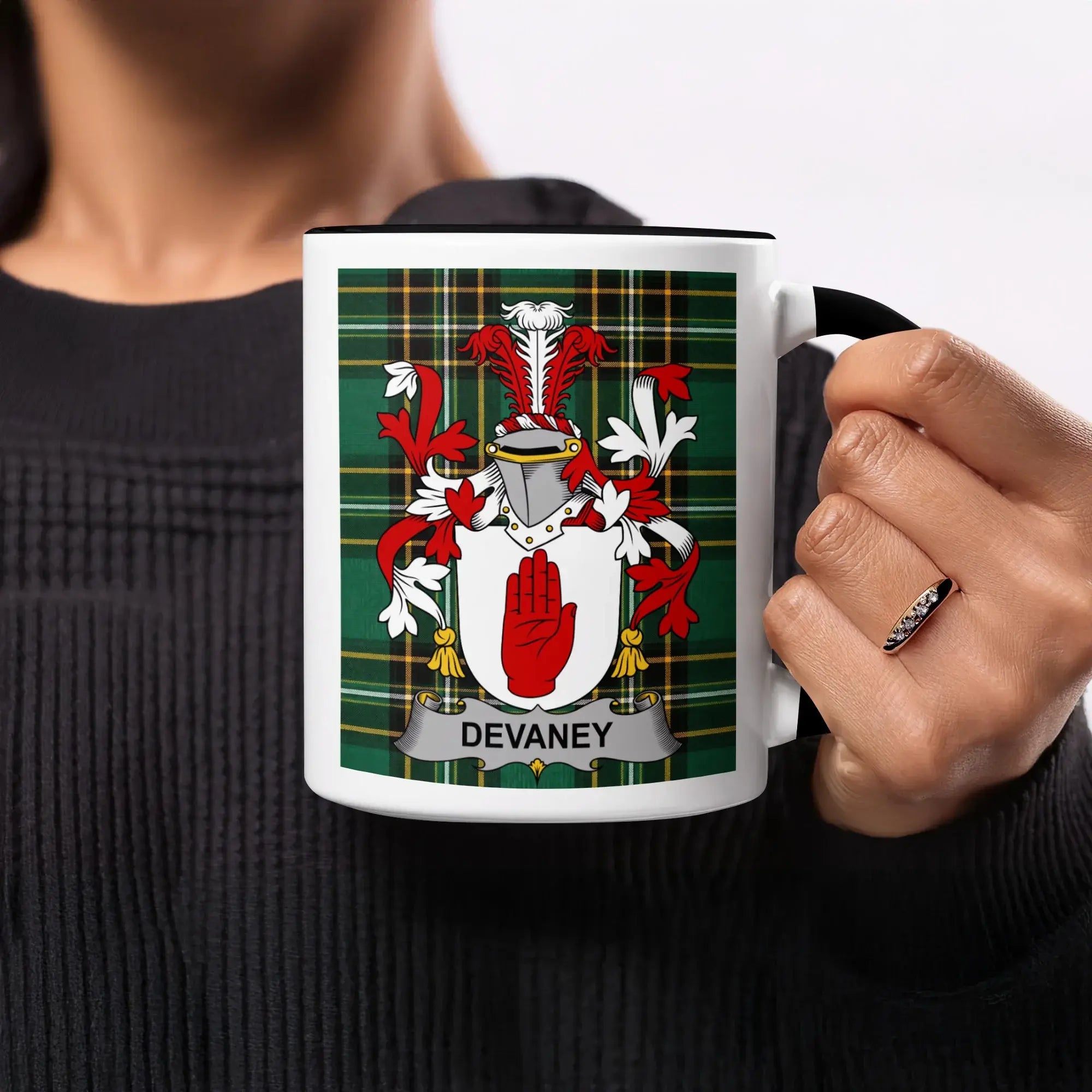 Mug with Devany family crest on tartan background.
