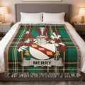 Green plaid blanket featuring a coat of arms with the name Merry.