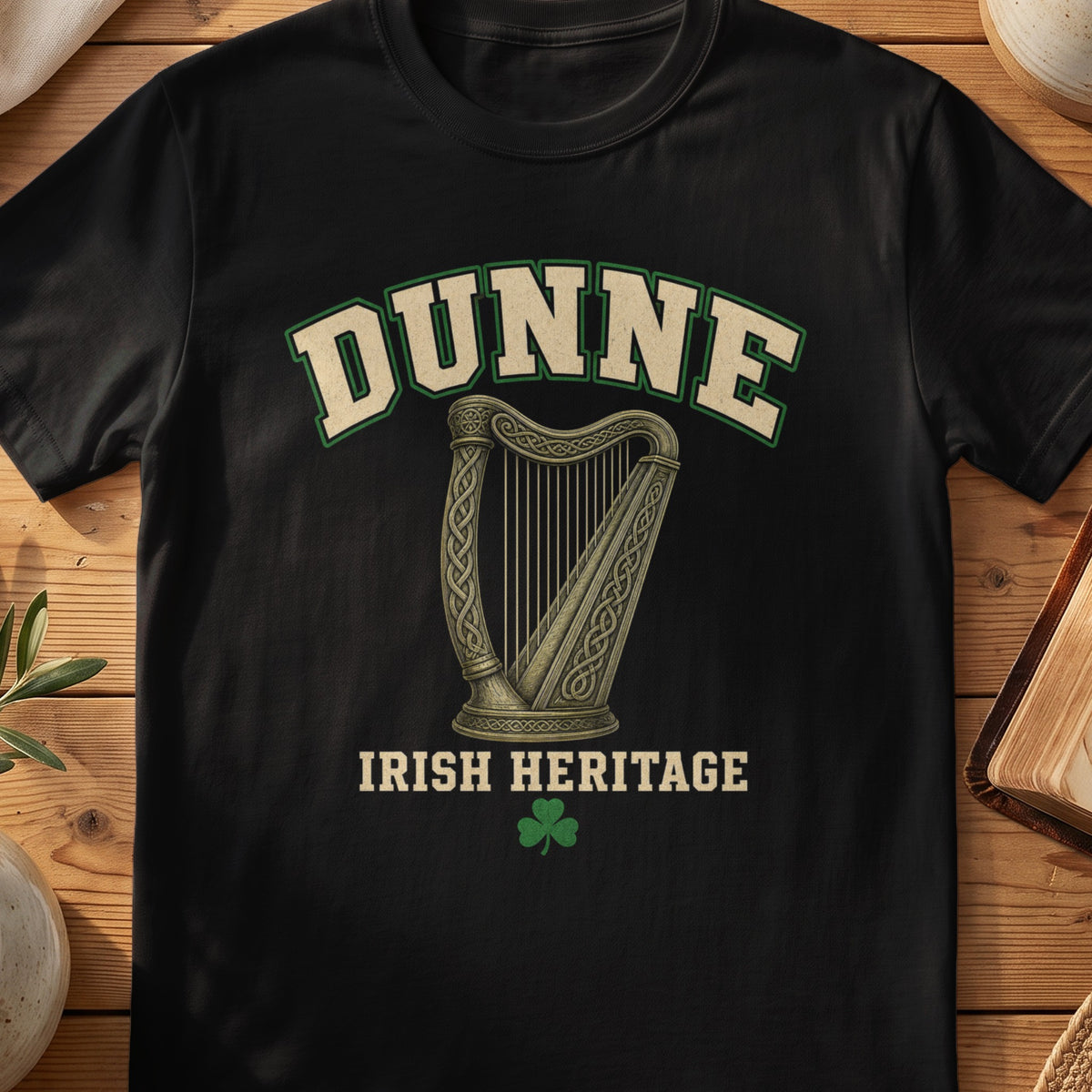 Dunne Irish harp T-shirt in Black, with cream surname lettering, a gold-toned harp, green shamrock and “Irish Heritage” text.