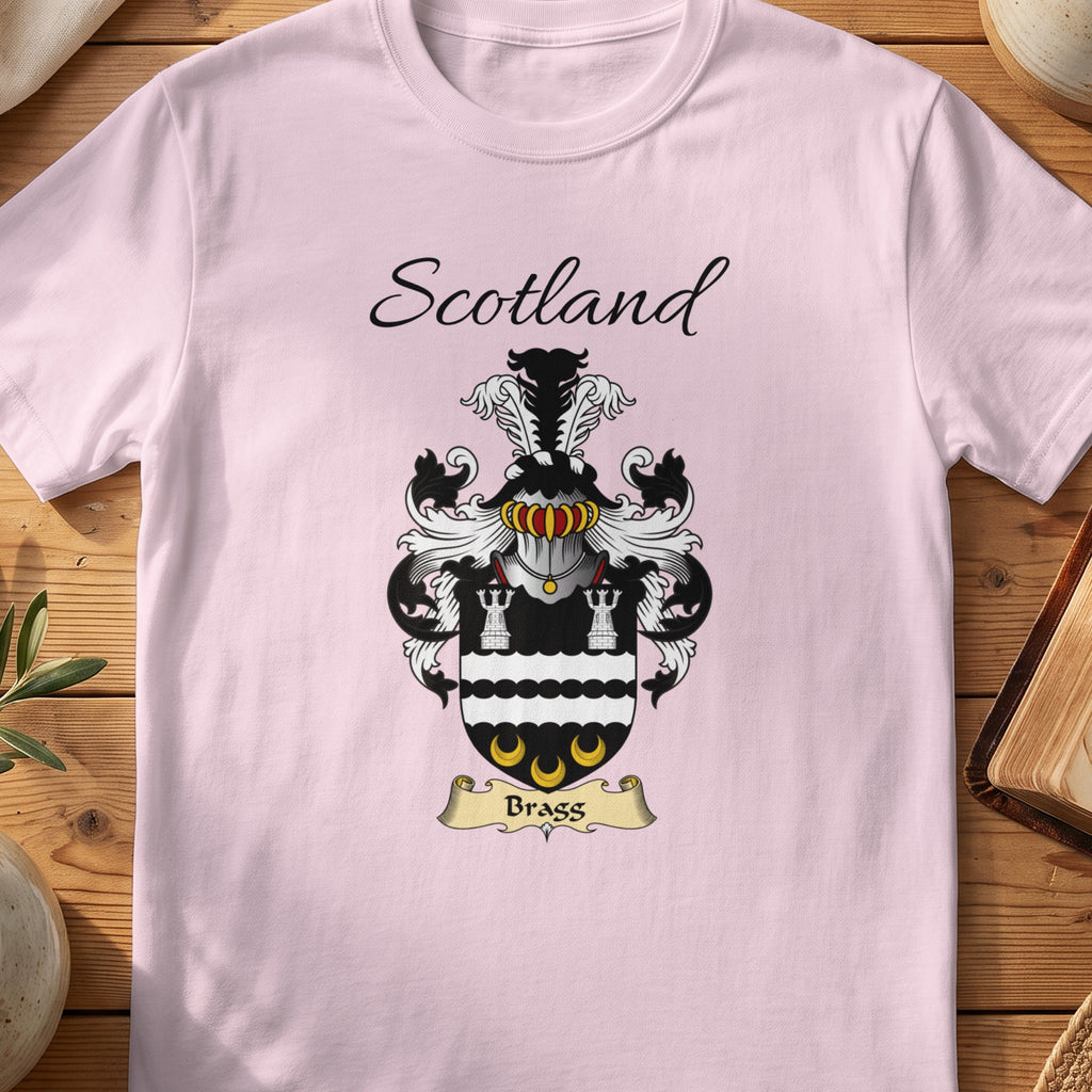 Light Pink Bragg Scottish family shield T-shirt featuring white towers and gold crescents on black